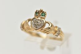 A 9CT GOLD GEM SET CLADDAGH RING, the heart shape set with three brilliant cut diamonds, the crown