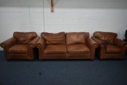 A BROWN LEATHER THREE PIECE LOUNGE SUITE, comprising a three seater settee, length 200cm x depth