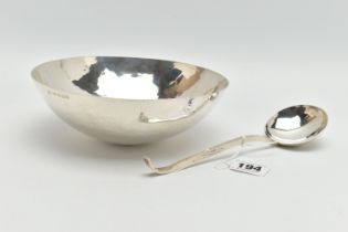 AN ELIZABETH II PLANISHED SILVER BOWL AND MATCHING LADLE, the bowl with domed base and the ladle