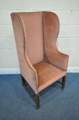 AN EARLY 20TH CENTURY GEORGIAN STYLE HIGH WING BACK ARMCHAIR, with pink studded upholstery, width