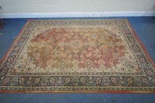 A WINDSOR RED AND CREAM GROUND RUG, with floral details, and a multistrip border, 200cm x 300cm (