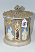 A METTLACH, VILLEROY & BOCH STONEWARE TOBACCO JAR, decorated with Gothic revival architectural