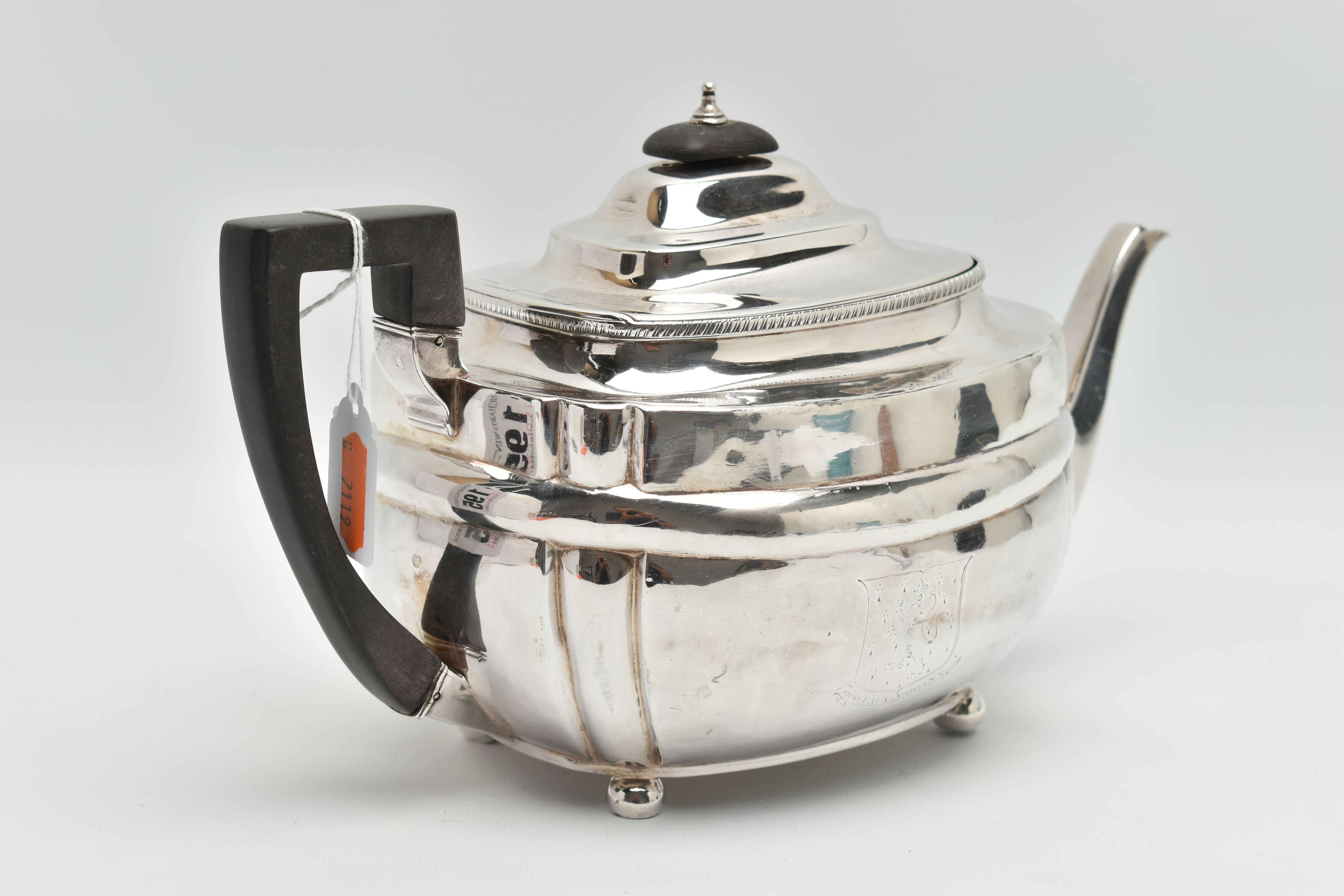 A GEORGE III SILVER TEAPOT, polished form, worn engraved crests to either side, on four ball feet, - Image 3 of 6