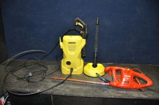 A KARCHER K2 PRESSURE WASHER, with patio head (no standard lance nozzle) and a Flymo Easicut 450