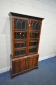 A BEVAN FUNNELL MAHOGANY BOOKCASE, with two glazed doors and two cupboard doors, width 106cm x