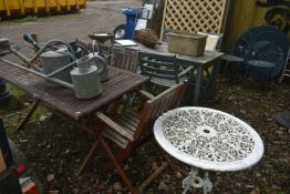 A STAINED TEAK FOLDING GARDEN TABLE, length 150cm x depth 87cm x height 73cm, three folding