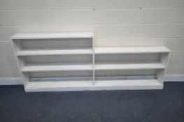 A WHITE PAINTED OPEN BOOKCASE, with seven shelves, length 233cm x depth 23cm x height 97cm (