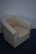 A PATTERNED UPHOLSTERED TUB CHAIR, another tub chair and a wooden framed footstool (condition