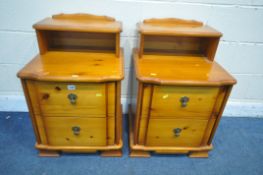 A PAIR OF MODERN PINE TWO DRAWER BEDSIDE CABINETS, with a single raised shelf, width 50cm x depth