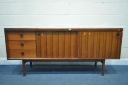 A GORDON RUSSELL ROSEWOOD SIDEBOARD, with three drawers to the left of cupboards, on circular