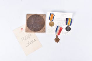 A WWI 1914 STAR TRIO AND MEMORIAL PLAQUE NAMED TO ISAAC BALL, the medals are all correctly named