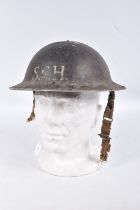 A WWII ERA BRITISH STEEL HELMET, it is in good condition for its age and only has the usual age