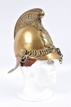 A LATE NINETEENTH OR EARLY TWENTIETH CENTURY STRE BRASS FIREMANS HELMET, this helmet has the usual