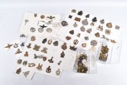 A COLLECTION OF VARIOUS MILITARY BADGES AND SHOULDER TITLES, they span various eras of the twentieth
