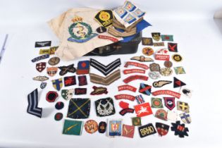A COLLECTION OF WWII UNIFORM INSIGNIA GIVEN TO V.A.D NURSE JESS WINIFRED CAREY DURING WWII, Miss