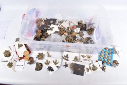 A VAST ASSORTMENT OF MILITARY CAP BADGES, buttons and shoulder titles, the badges include army
