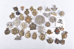 A SELECTION OF MILITARY CAP BADGES FROM DIFFERENT ERAS, these include the 40th second
