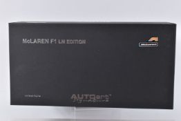 A BOXED AUTOART SIGNATURE MCLAREN F1 LM EDITION 1:18 SCALE MODEL VEHICLE, orange body, appears in