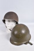 TWO USA ARMY STEEL HELMETS FROM WWII AND VIETNAM WAR ERA, the WWII era helmet is complete with inner