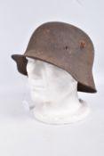 A WW1 ERA GERMAN HELMET RELIC WITH BATTLE DAMAGE, this is just the shell and there is damage to
