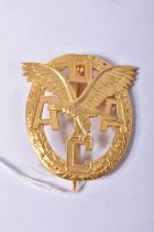 A GERMAN THIRD REICH ADAC BADGE IN GOLD, this is an Allegmiener Deutscher Automobile club badge,