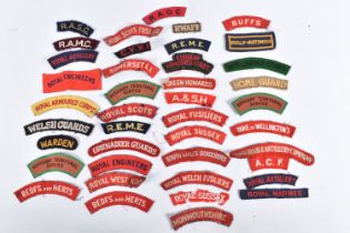 A COLLECTION OF WWII ERA UNIFORM CLOTH SHOULDER TITLES, this was part of the collection that was