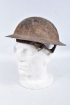 A WWI OR LATER BRITISH STEEL HELMET, it has paint losses and surface rust in places, there is a