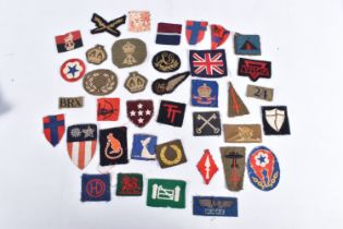 A NICE SELECTION OF UNIFORM INSIGNIA COLLECTED BY V.A.D NURSE JESS WINIFRED CAREY DURING WWII,