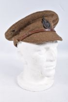 A WWI ERA BRITISH ARMY PEAKED CAP WITH LEEDS RIFLES CAP BADGE, the hat is in good condition and