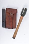 A LEATHER POUCH CONTAINING THREE EMPTY MP34 MACHINE GUN BULLET CLIPS, a replica German stick