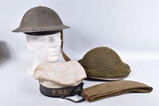 FOUR BRITISH MILITARY HATS, to include two steel helmets, a side cap and a Naval rating hat, the