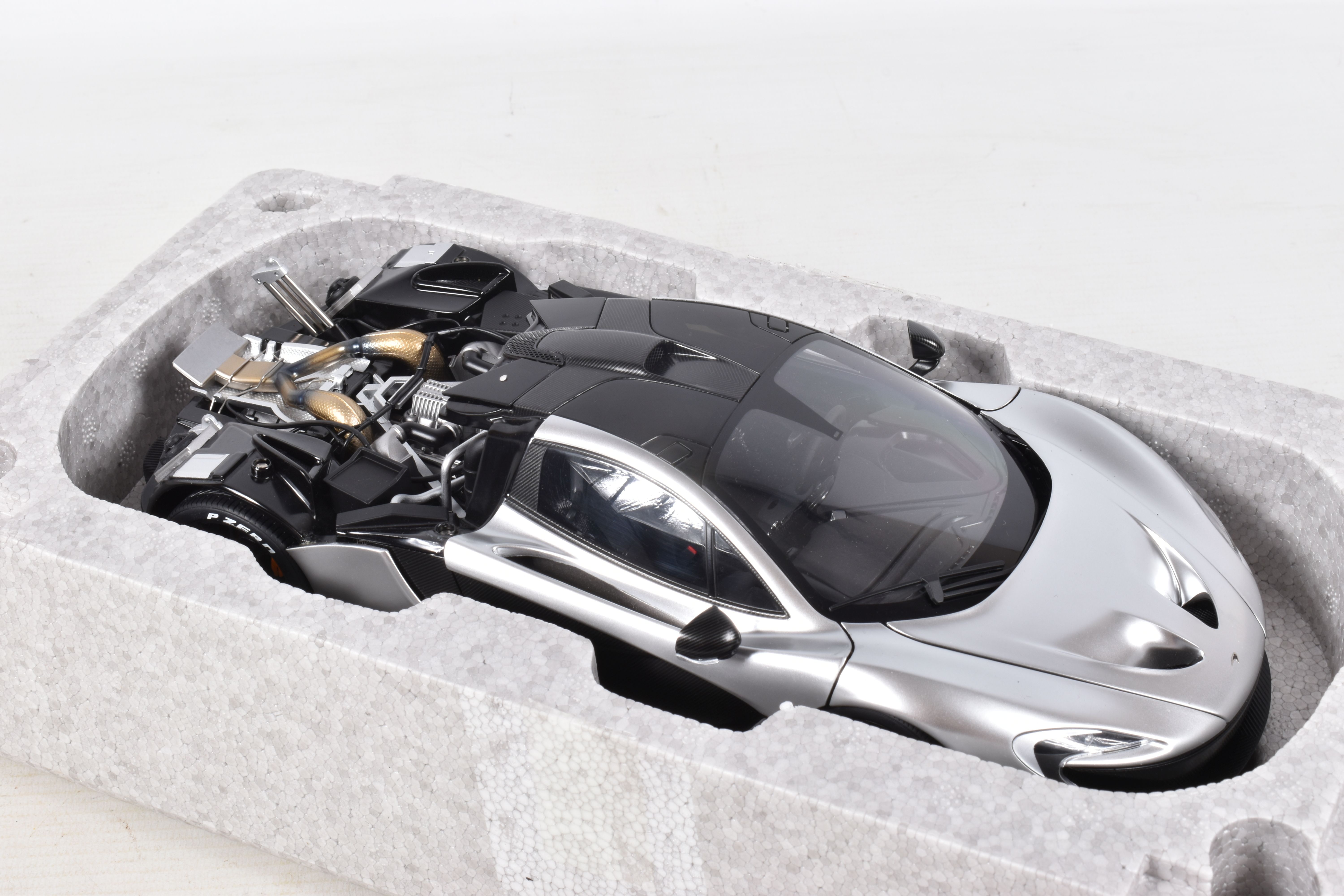 A BOXED AUTOART SIGNATURE MODEL MCLAREN P1, 1:18 scale, numbered 76026 in matt chrome, appears in - Image 7 of 8