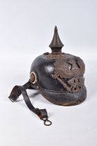 A WWI ERA IMPERIAL GERMAN PICKLEHAUBE HELMET COMPLETE WITH HELMET PLATE, this is complete with liner