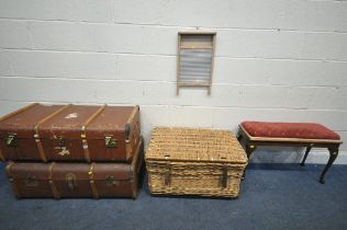 TWO VINTAGE CANVAS TRAVELLING TRUNKS, with wooden and metal banding, a wicker basket on wheels,