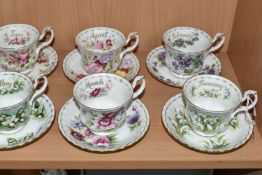 A SET OF ROYAL ALBERT 'FLOWERS OF THE MONTH' TEA CUPS AND SAUCERS, twelve cups and saucers