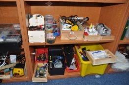A SELECTION OF TOOLS AND GLUES including soldering irons, a multimeter, various pliers,