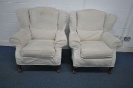 A PAIR OF 20TH CENTURY WING BACK ARMCHAIRS, with later covers, width 96cm x depth 94cm x height