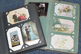 TWO ALBUMS OF POSTCARDS containing approximately 501 early 20th century postcards, (with