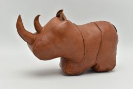 A DECORATIVE LEATHER DOOR STOP IN THE FORM OF A RHINOCEROS, approximate height 17cm, length 28cm,