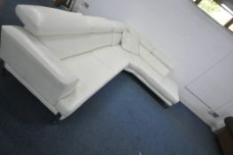 A WHITE LEATHER L SHAPED CORNER SOFA, with three adjustable head rests, on shaped metal legs,