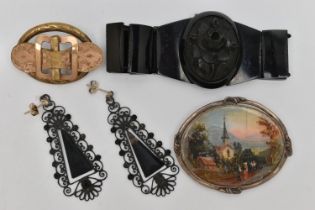 A JET BRACELET, TWO BROOCHES AND A PAIR OF EARRINGS, the bracelet with a carved high relief jet