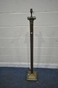 A BRASS CORINTHIAN COLUMN STANDARD LAMP, with a square base, on claw feet, height 137cm (condition