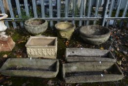 SEVEN VARIOUS WEATHERED COMPOSITE PLANTERS, to include an urn, an urn with no base, two planters and