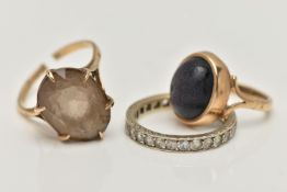 THREE GEM SET RINGS, to include a blue goldstone cabochon ring, collet set to the bifurcated