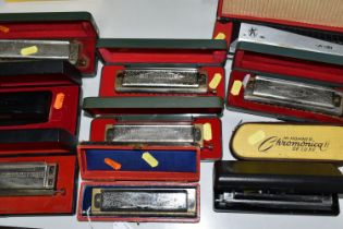 A GROUP OF TEN CASED HOHNER HARMONICAS, comprising The 64 Chromonica professional model, a CX12, a