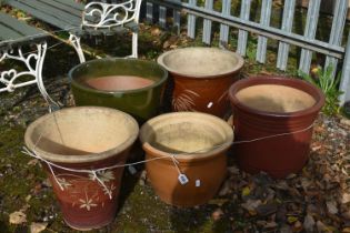 FIVE VARIOUS GLAZED PLANT POTS, of various sizes, largest plant pot diameter 38cm x height 37cm (