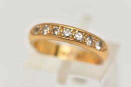 A 22CT GOLD DIAMOND BAND RING, a combination of single cut and round brilliant diamonds, seven