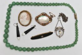 A BAG OF ASSORTED JEWELLERY, to include a base metal carved shell cameo brooch, a shell and base