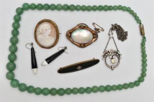 A BAG OF ASSORTED JEWELLERY, to include a base metal carved shell cameo brooch, a shell and base