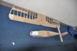 A PARTIALLY BUILT LARGE MODEL PLANE wingspan 87in, wings has no skin, some parts not fixed in place,